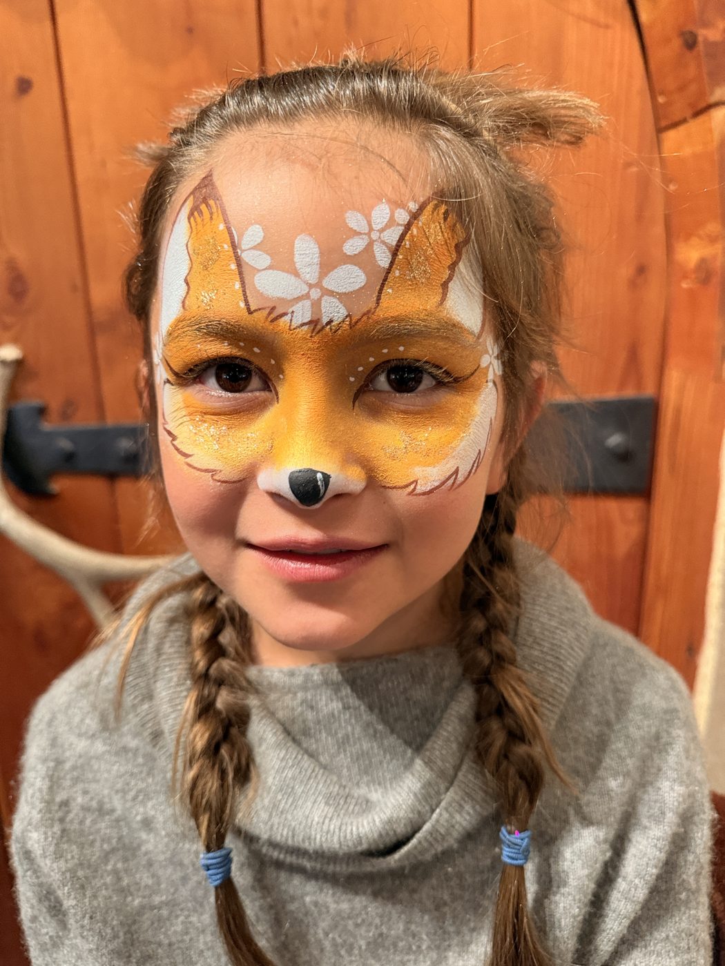 Woodland fox face paint with flowers